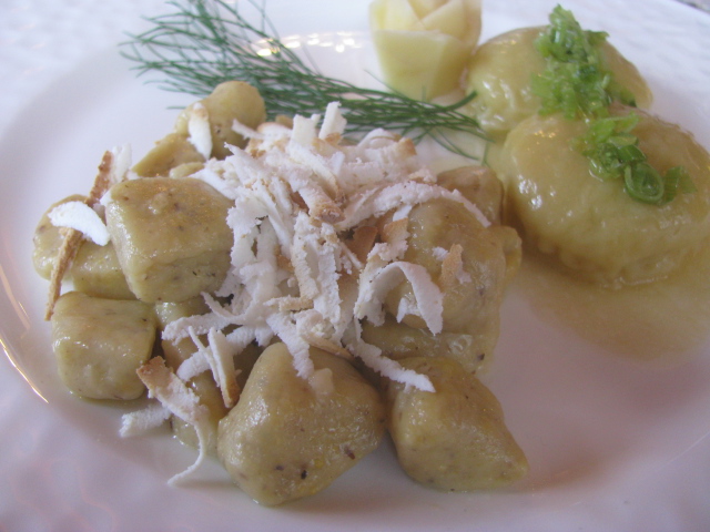 First course at the Cavallino Bianco - Hearty corn and potato dumplings topped with Trentin Grana, butter, sage and leeks 